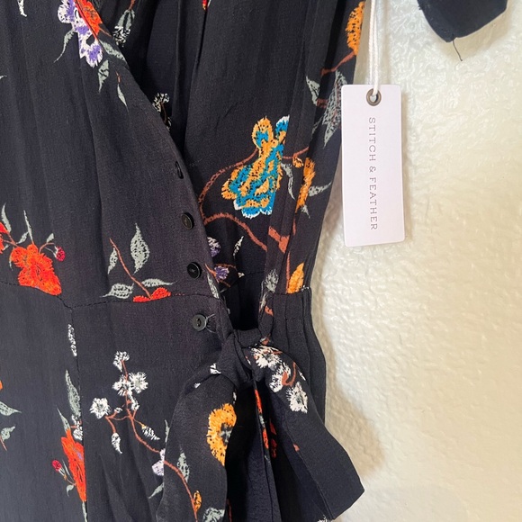 Stitch and feather never worn before with tags on romper. - Picture 1 of 4